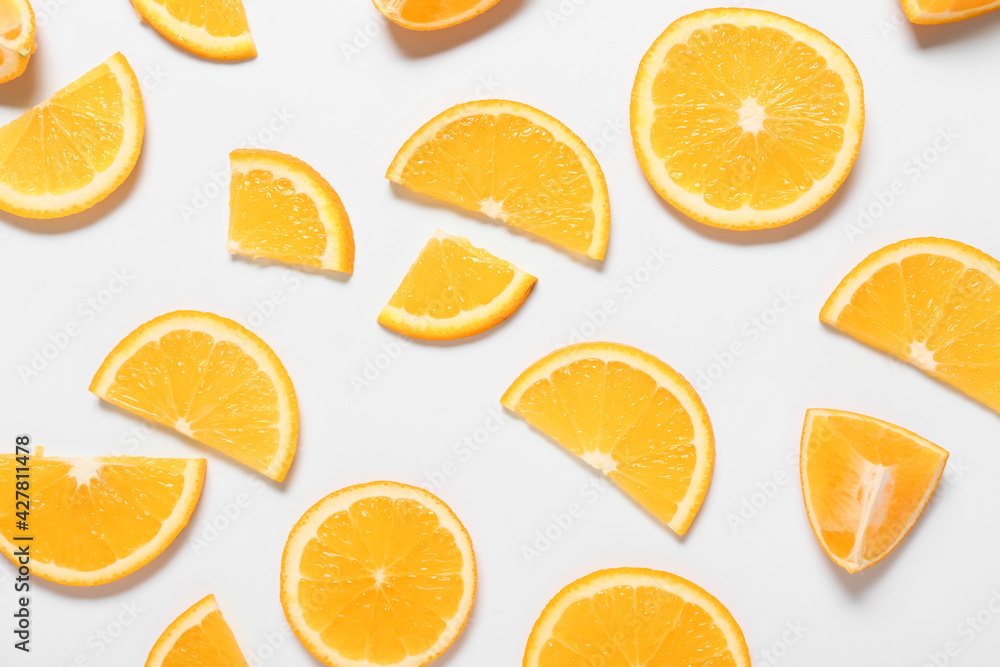 Fresh orange pieces on white background