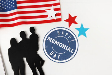 Greeting card for Memorial Day celebration with USA flag and figure of family on white wooden background