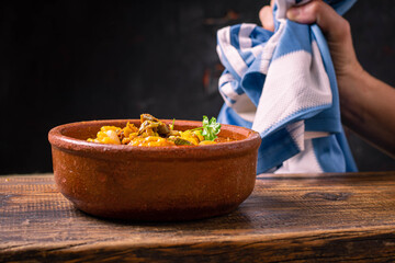 Wall Mural - cazuela de locro traditional food and typical Argentine flag