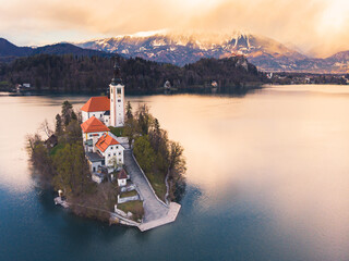 Most famous Slovenian lake and island Bled. Aerial view of Island in Bled Lake. Bled Castle in background. Lake Bled with castle, Slovenia, Europe.