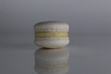 Wall Mural - white macaroon on a gray background French pastry dessert with a place for text copyspace