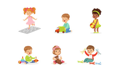 Poster - Happy Cute Kids Playing Toys Set, Little Boys and Girls Hugging Teddy Bear, Playing with Ball, Car, Pyramid Cartoon Vector Illustration