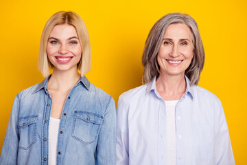 Sticker - Photo portrait of mother and daughter wearing stylish outfit smiling isolated vibrant yellow color background