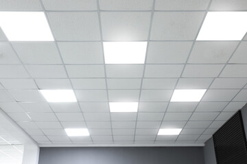 white ceiling with lighting in office room