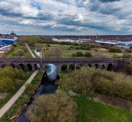 Wall Mural - An aerial view looking down over the Far Cotton Railway viaduct in Northampton, UK on a Spring day