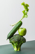 Fresh green vegetables on on the table. Equilibrium floating food balance. Food creative concept, levitation
