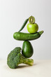 Fresh green vegetables on on the table. Equilibrium floating food balance. Food creative concept, levitation