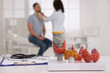 © New Africa - Doctor examining thyroid gland of patient in hospital, focus on organ models