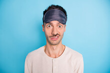 Portrait Of Nice Puzzled Brunet Guy Wearing Sleep Mask Cant Asleep Dislike Isolated Over Bright Blue Color Background