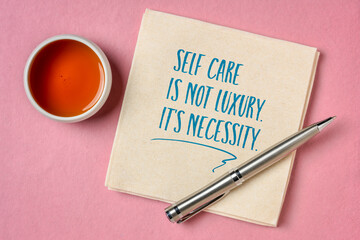 self care is not luxury, it is necessity inspirational reminder - handwriting and doodle on a napkin
