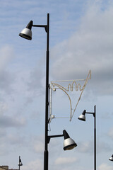 Wall Mural - Vertical shot of street lights during a cloudy day