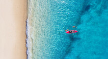 Kayaking. Sup. Aerial View Of Floating Board And People On Blue Sea At Sunny Day. Summer Seascape. Landscape From Drone. Travel And Active Life Image.