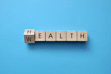 Wooden Cubes With The Words: Health And Wealth. Health Is The Main Wealth