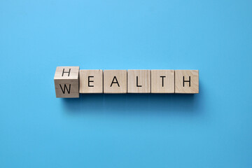 Wall Mural - Wooden cubes with the words: health and wealth. Health is the main wealth