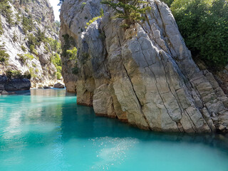 Wall Mural - Seascape against the backdrop of mountains on a cloudless sunny day.