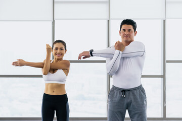 Wall Mural - athletic couple workout  with stretching in gym and fitness center