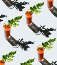 Carrot Juice With Celery On Gray Background Pattern