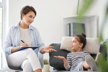 Poster - Female psychologist working with little girl in office