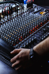 Professional audio studio sound mixer console board panel with recording , faders and adjusting knobs,TV equipment.