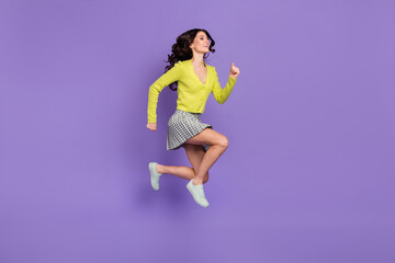 Poster - Full length body size side profile photo of pretty girl in plaid skirt jumping running isolated pastel violet color background