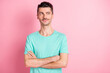 © deagreez - Photo of young handsome happy positive dreamy man look copyspace with folded hands isolated on pink color background