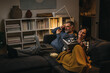 © cherryandbees - middle age couple enjoying time at home. evening scene