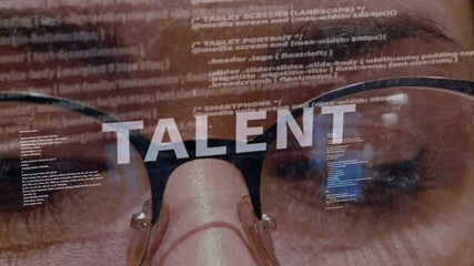 talent text on the background of female software developer. eyes of woman with glasses are looking a