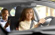 © Syda Productions - transportation, vehicle and people concept - happy smiling female driver driving car with male passenger