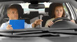 © Syda Productions - driver courses, exam and people concept - young woman and driving school instructor with clipboard in car