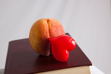 A sweet, ripe peach and a heart