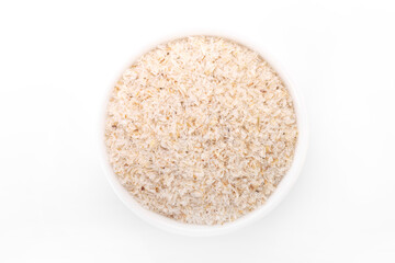 psyllium husk. psyllium husk in white bowl on white background.