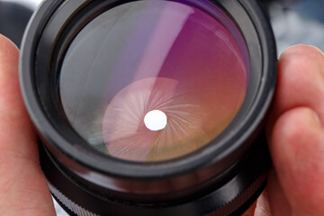 close-up view of black large format photographic lens with closed iris aperture unit with 20 blades