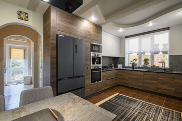 Modern luxurious dark brown, gray and black kitchen details