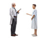 © Ljupco Smokovski - Full length profile shot of a young male patient talking to a mature male doctor