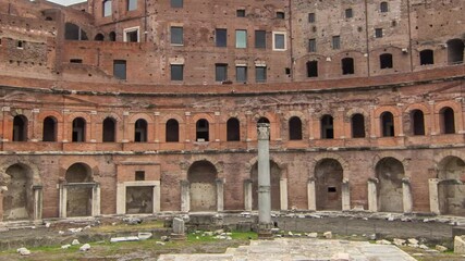 Wall Mural - A panoramic view on Trajan's Market timelapse hyperlapse (Mercati Traianei) on the Via dei Fori Imperiali, in Rome, Italy. Cloudy sky