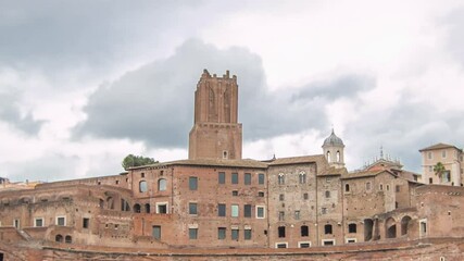 Canvas Print - A panoramic view on Trajan's Market timelapse hyperlapse (Mercati Traianei) on the Via dei Fori Imperiali, in Rome, Italy. Cloudy sky