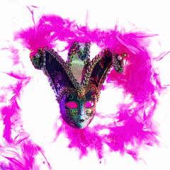 Masquerade mask with bells, with patterns and ornaments, embroidered with gold thread on a white background around pink feathers