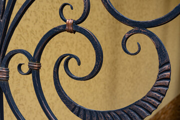 Beautiful forged elements of a metal fence