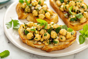 Wall Mural - Healthy bruschetta with chickpea salad and herbs