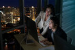 © godji10 - Selective Focus. Female telemarketers operators working late at night in a call center. Technical, Customer service use a headset to answering customer questions. Telemarketing Communication support.