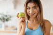 © Afshar Tetyana - Beautiful lady posing with a green apple and smiling