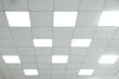© New Africa - White ceiling with lighting in office room