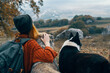 © SHOTPRIME STUDIO - woman hiker in nature with dogs adventure travel