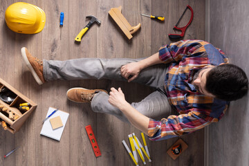 Wall Mural - Man worker sitting on floor thinking idea solutions. Designer man planning or relaxing