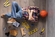 © Sergii Moscaliuk - Man worker lying on floor thinking idea solutions. Designer man planning or relaxing