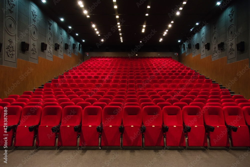An empty cinema room with red velvet seats. Empty cinema. - obrazy, fototapety, plakaty 