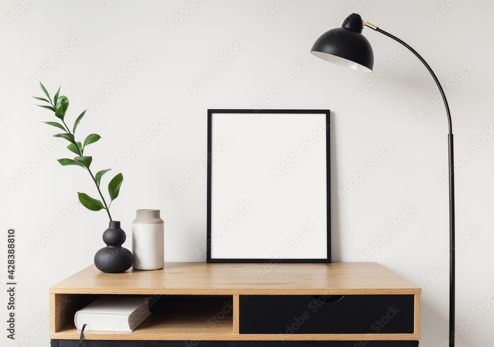 Blank picture frame mockup on white wall. White living room design. View of modern scandinavian style interior with artwork mock up on wall. Home staging and minimalism concept - obrazy, fototapety, plakaty 