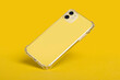 © iso100production - Yellow iPhone 11 in clear silicone case falls down isolated on yellow background back view. Phone case mockup