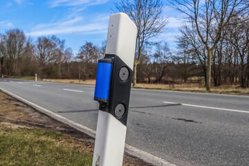 Sticker - Traffic post at a country road in Germany with blue reflecting elements