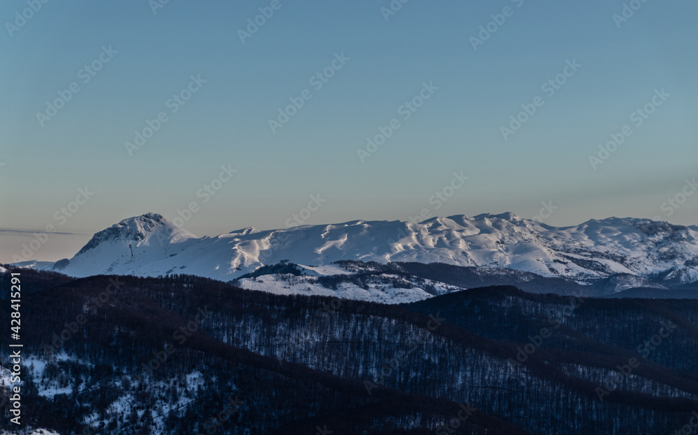 Snow covered mountains in the morning